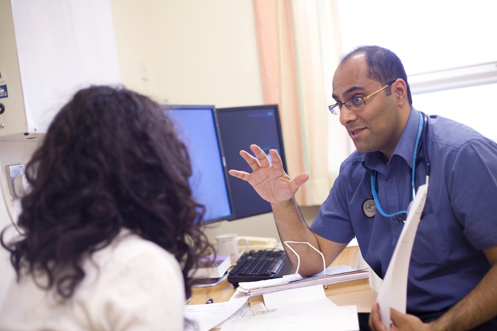 Patient Engagement Male Clinician Talking To Patient (1)